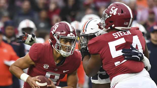 Nov 26, 2022; Tuscaloosa, Alabama, USA; Alabama Crimson Tide quarterback Bryce Young (9) drops back to pass as offensive lineman Tyler Steen (54) blocls against the Auburn Tigers at Bryant-Denny Stadium. Alabama won 49-27. Mandatory Credit: Gary Cosby Jr.-USA TODAY Sports